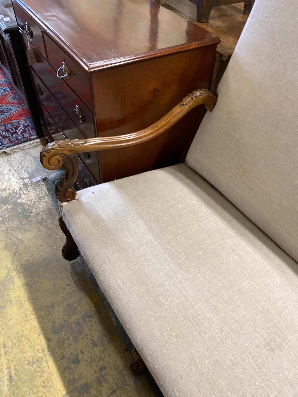 A Louis XVI style walnut settee recently upholstered in studded natural fabric, length 170cm, depth 74cm, height 116cm